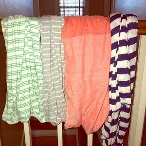 4 scarves. 3 on the left are infinity scarves.